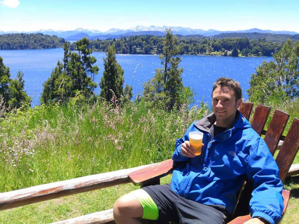 Chiropractor Matt relaxing in a chair with a beer