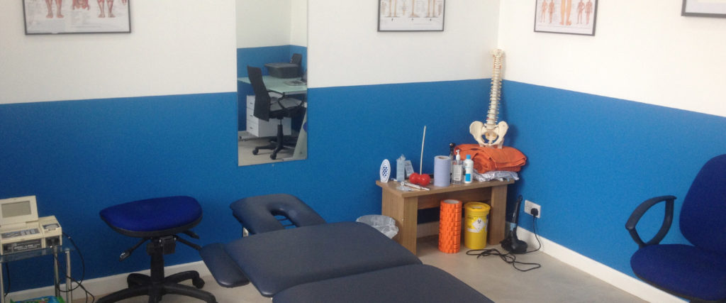 Chiropractic treatment room with massage table