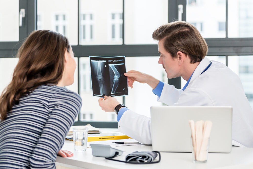 Doctor showing a patient an X-ray