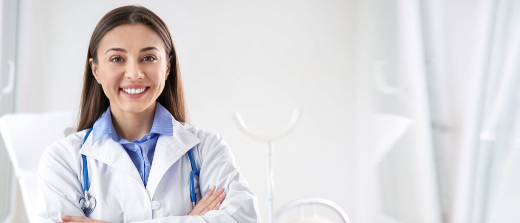 Smiling doctor looking straight